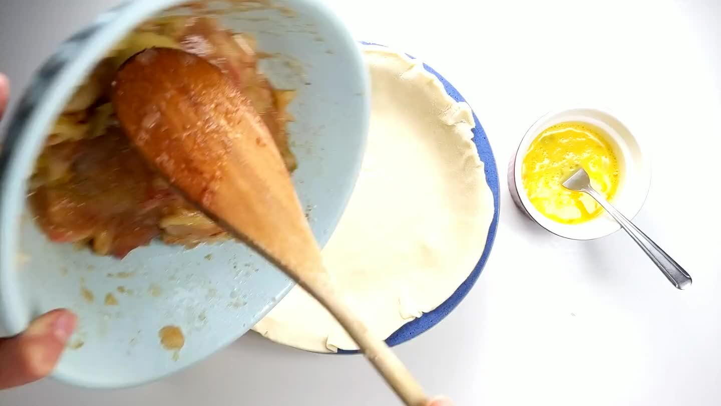 ce the apples are in, unroll the second roll of pie dough to cover over the top.