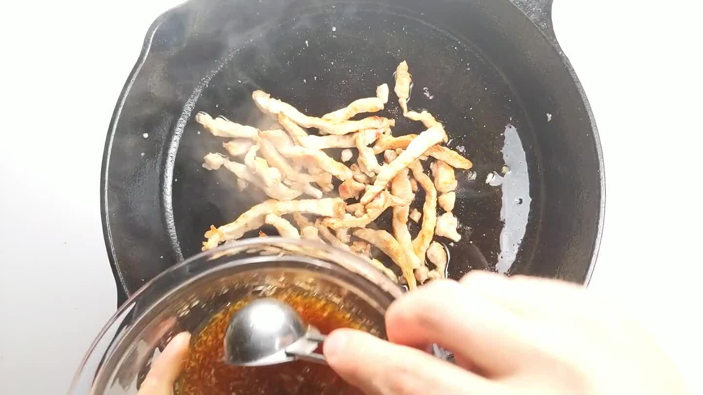 The sauce should quickly reduce to a sticky coating on the pork, at which point, you should remove the skillet from heat and transfer the pork strips to a separate dish to cool.