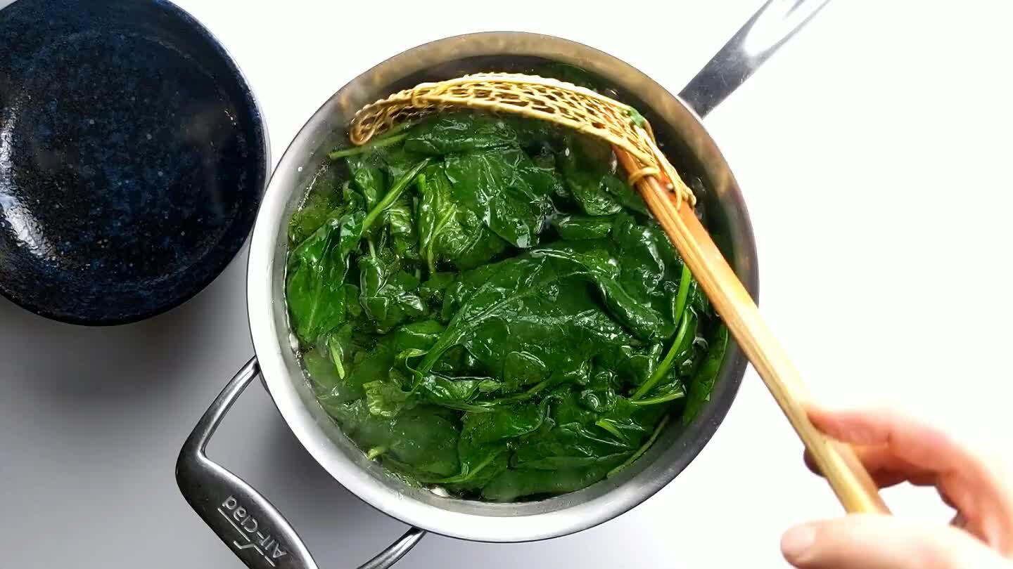 just until tender. Remove the spinach from the hot water and set it aside to drain.