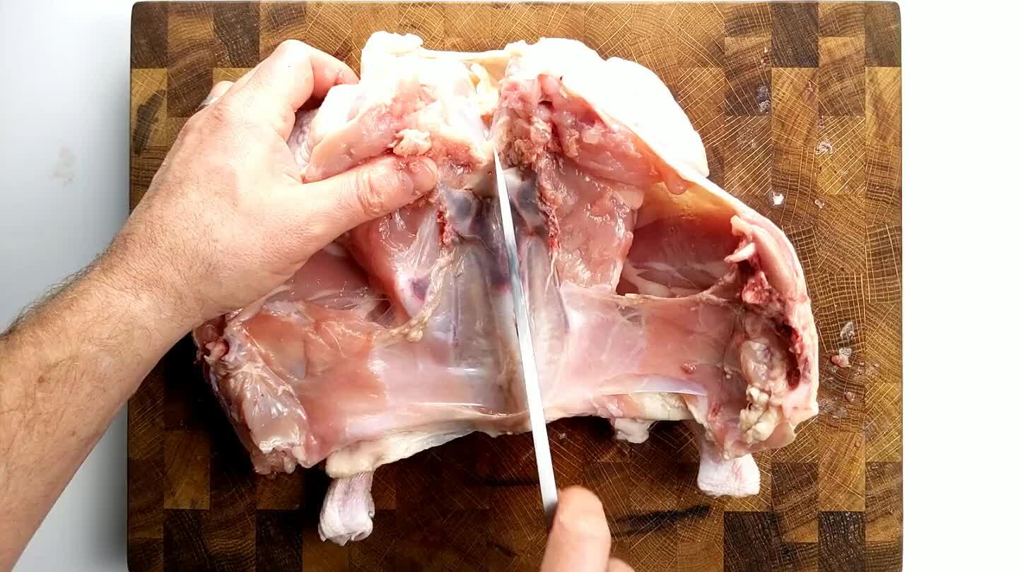 fragile, mostly made up of cartilage. Slice through the center of the bone without slicing too deeply into the breast. You don't want to slice the chicken in half here.