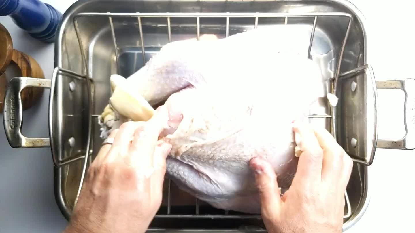 some slices of butter under the skin of both the thighs and the breast. As the turkey roasts, the butter will soak into the skin and crisp it up.