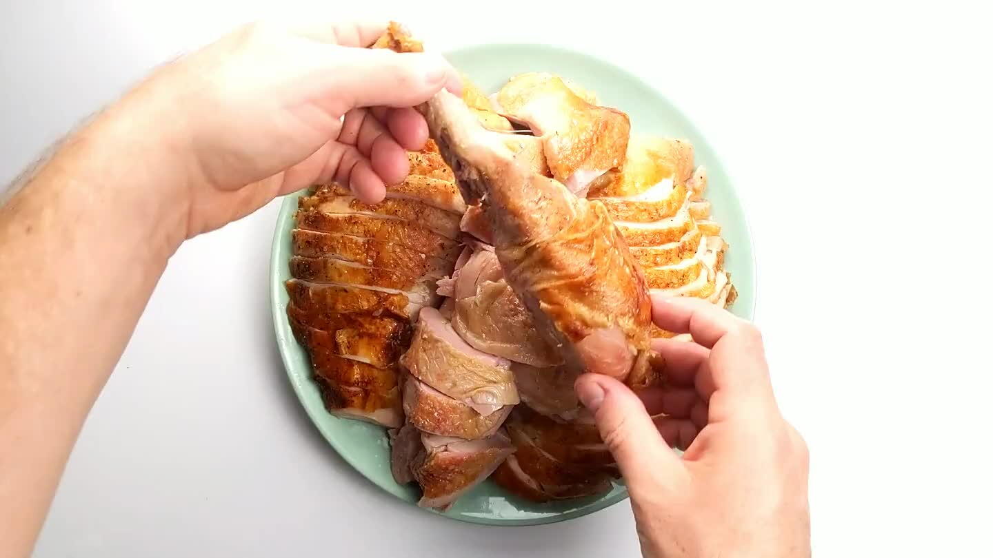 at in the middle and surround it with the neatly sliced breast meat, then perch the drumsticks and wings on top.