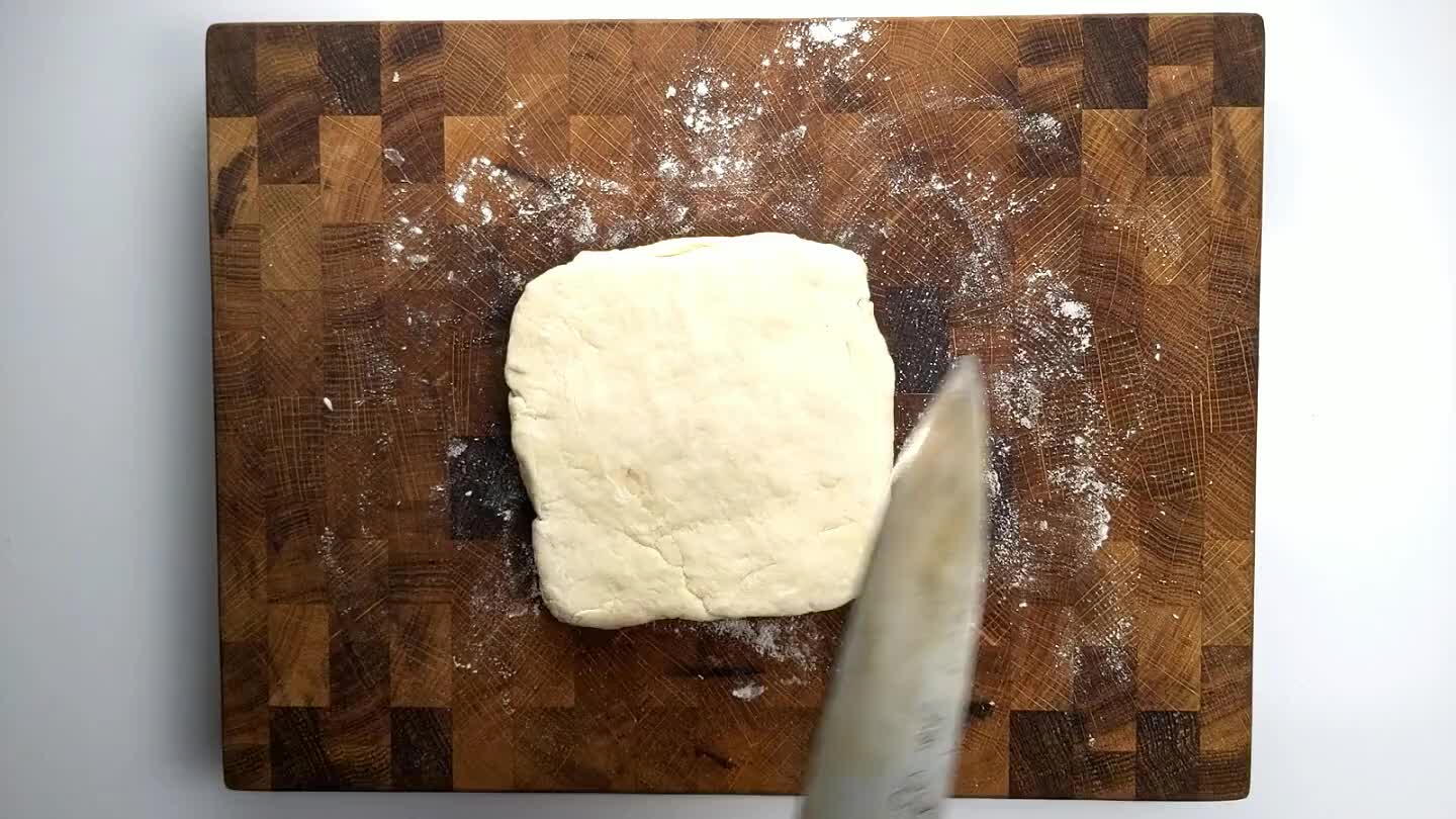 knife. Trim the edges and divide the dough.