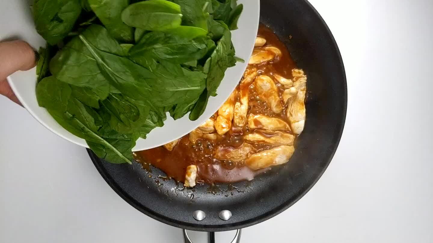 Leave the lid on for 3 minutes and let the spinach steam slightly. Remove the lid, and you are ready to serve over rice!