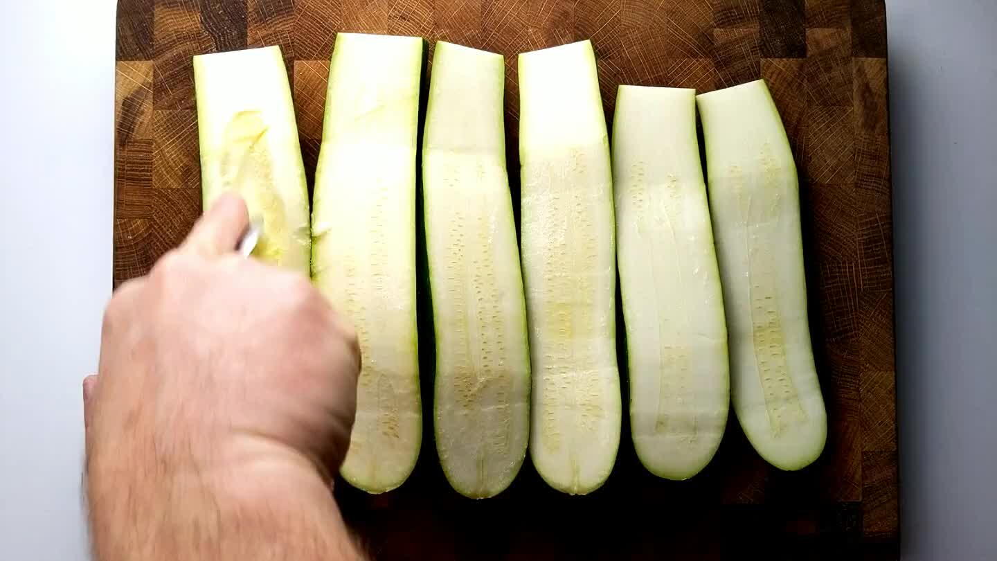 empty channel down the length of each zucchini half.