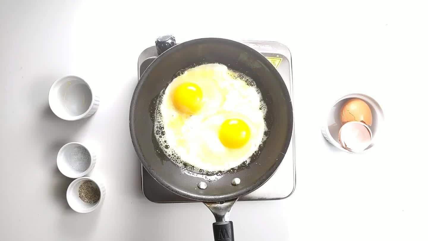 hot butter on top of the egg to help it finish cooking.