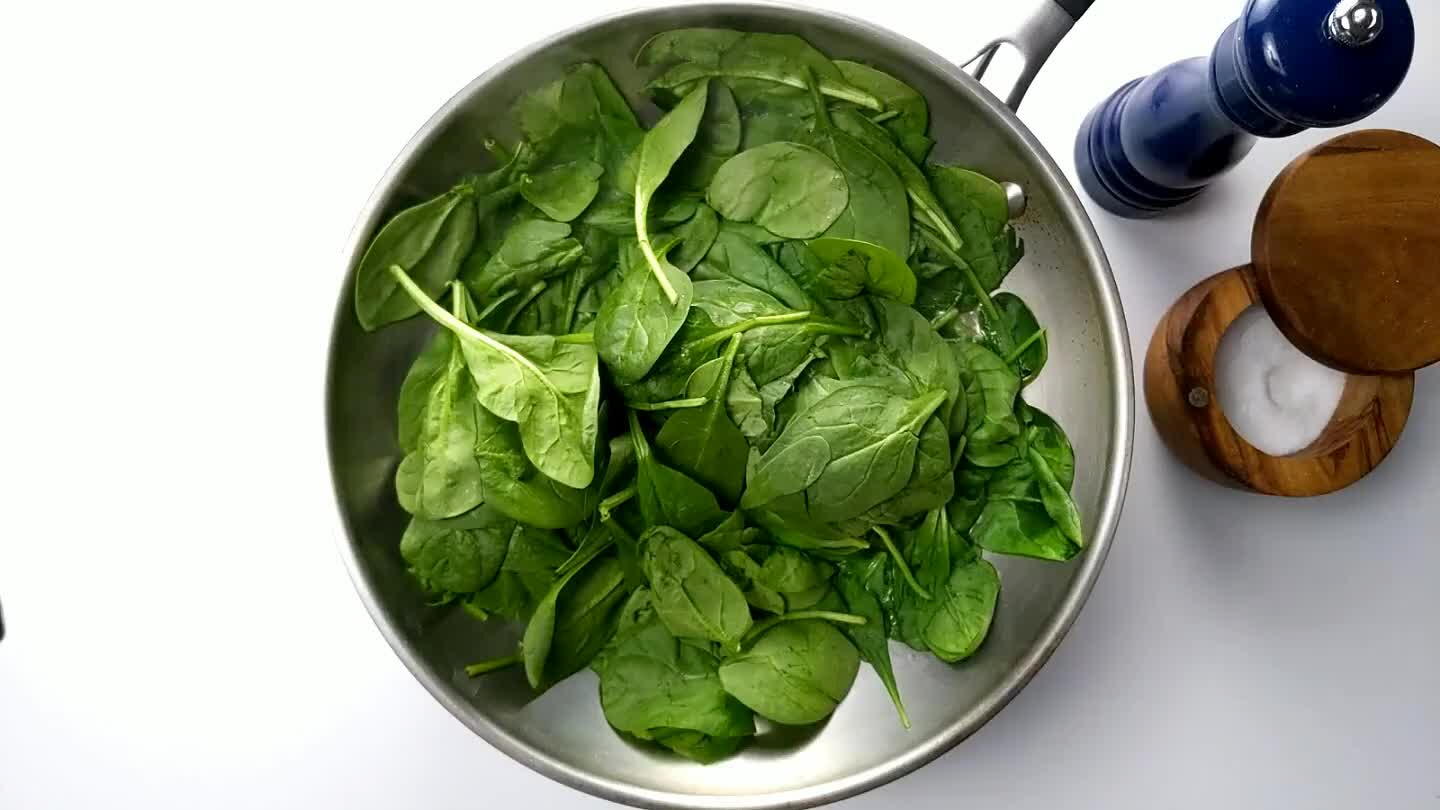 dium heat, turning the spinach frequently until all of the leaves are shiny.