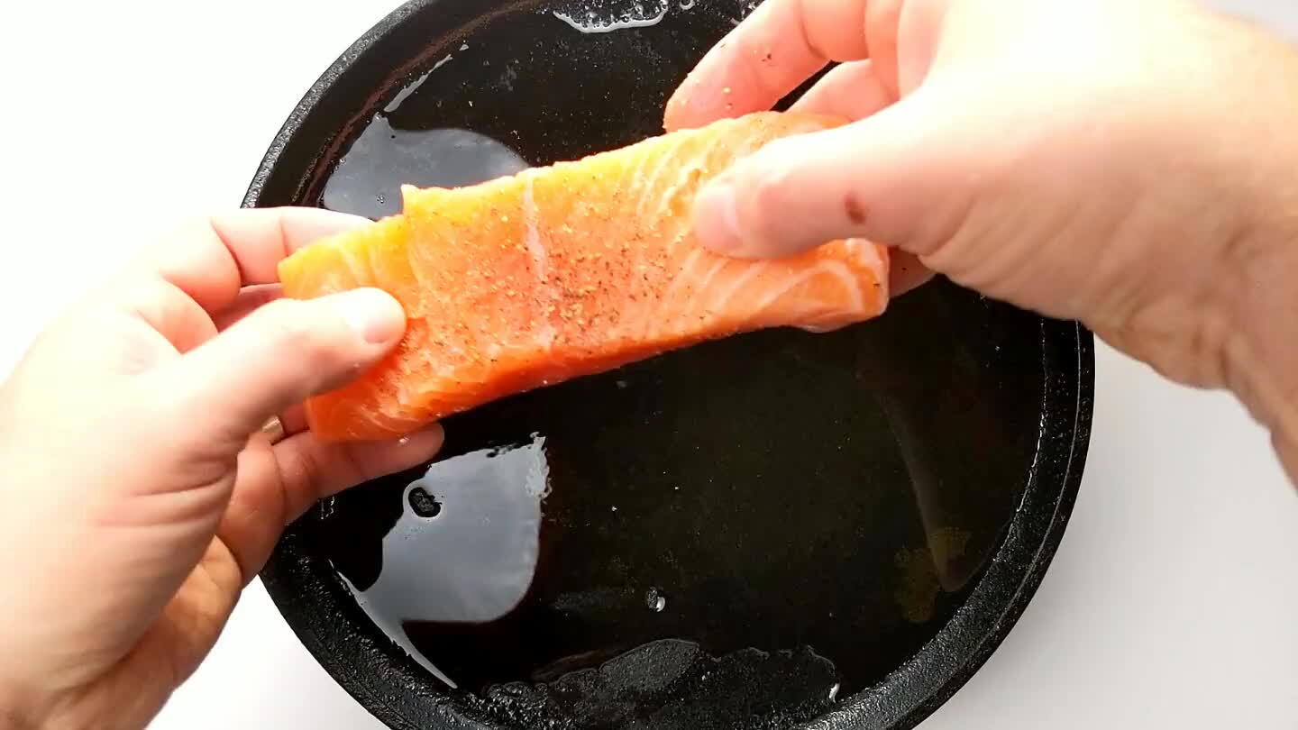little press to seal the skin to the pan. Reduce the heat slightly to medium-high. Don't touch the salmon fillet for at least 5 minutes. It's important to let the skin crisp undisturbed.