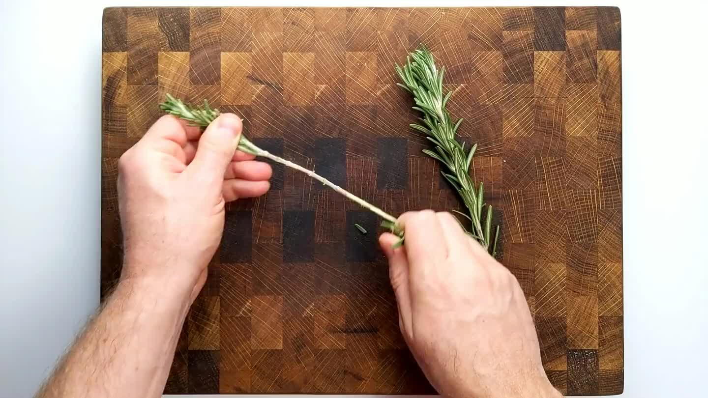 drag your fingers against the growth direction of the rosemary leaves to tear them from the stem. Chop up the leaves.