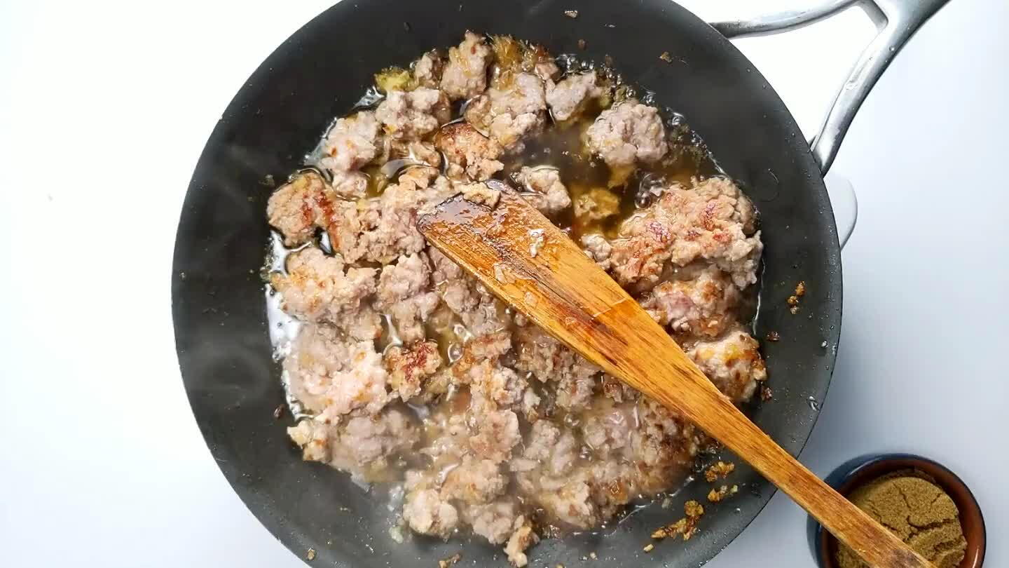at as the sugar and fish sauce thicken and caramelize. When the pork looks dark and the sauce is thick and caramely, transfer to a colander or paper towels to drain off some of the grease.