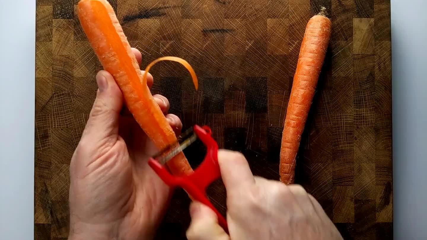peeler, shave the carrot into fine strips.