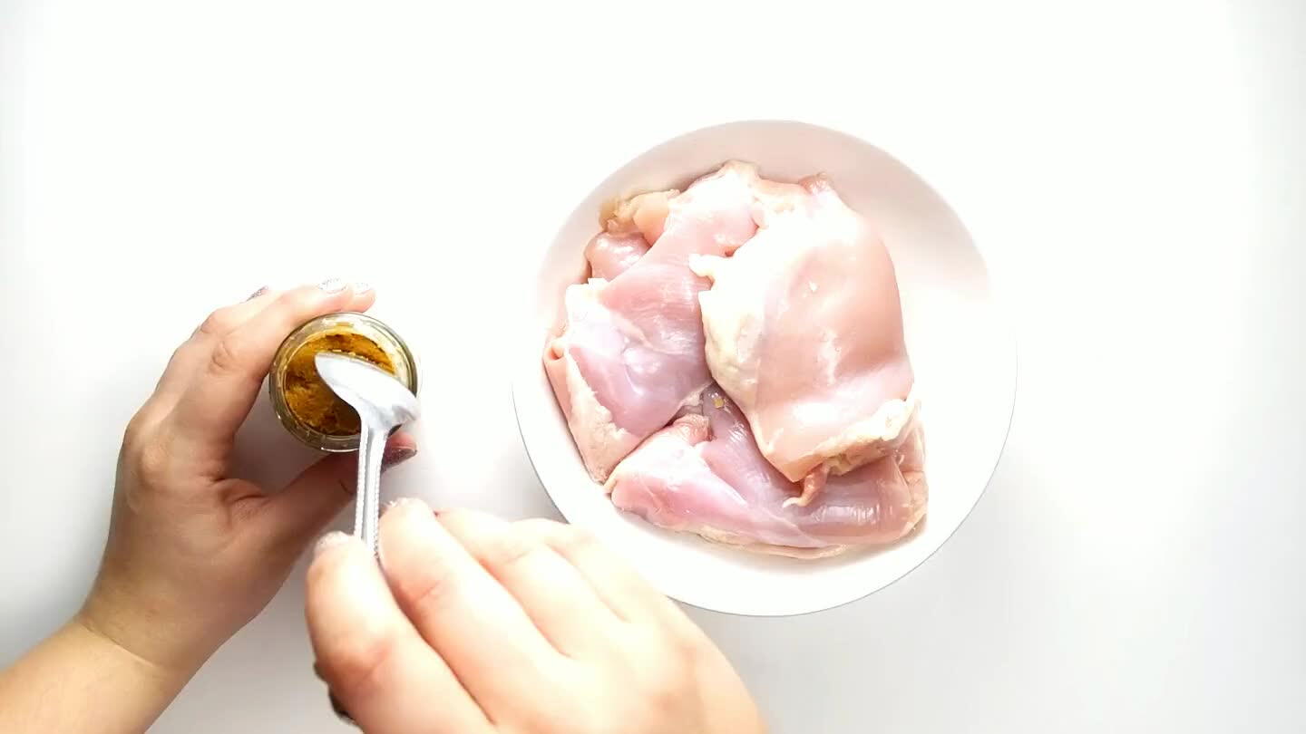 your fingers to rub the paste into the chicken.