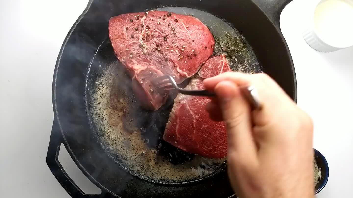 ittle to let them cook more slowly on the un-peppered side. Cook until caramelized. A meat thermometer should read an internal temperature at the center of 145°F for medium rare.