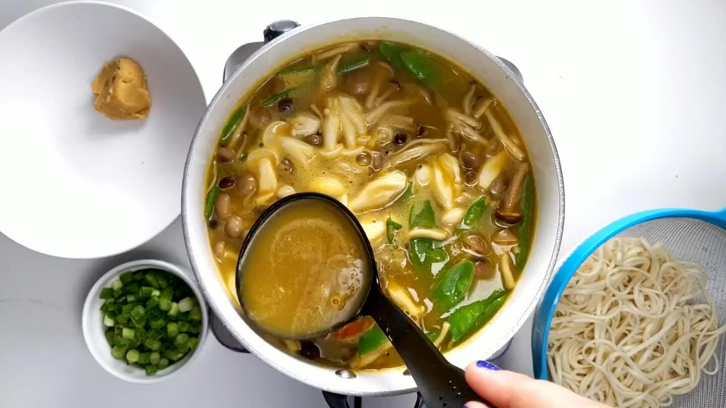 il the miso is completely dissolved, then pour the entire miso mixture into the pot with the soup.