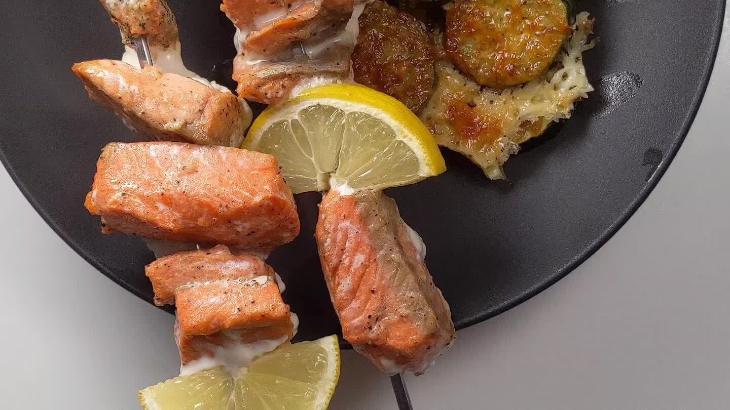 8 mins. After 3 minutes of cooking, add the salmon skewers to the oven. Then broil each pan on the top shelf of the oven for 3 minutes to crisp up the cheese.
