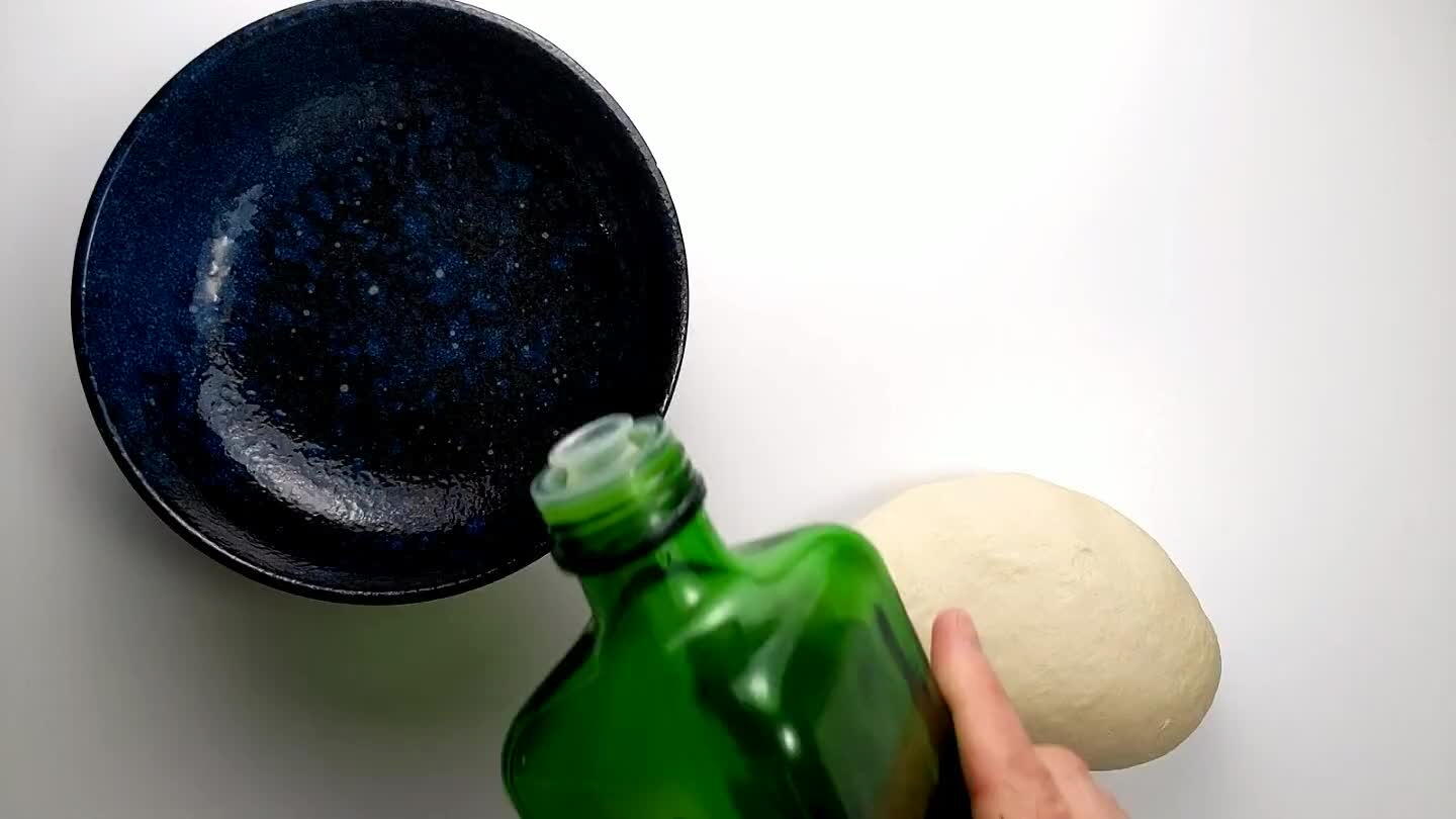 ough ball. Place the dough in there and flip it to coat in oil. Cover with plastic wrap or a kitchen towel. Let it proof in a warm spot in your kitchen for about 90 minutes.
