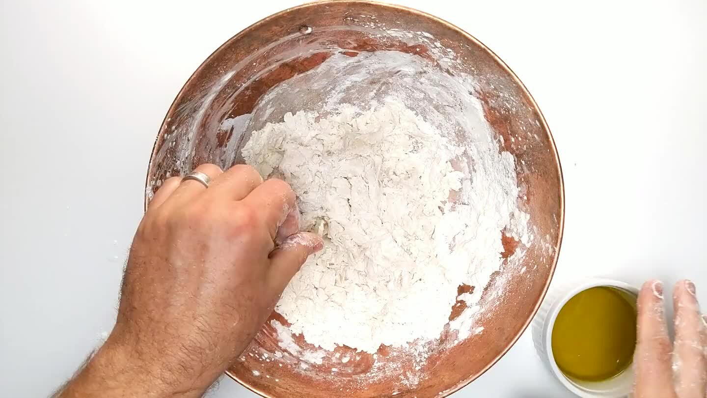hy ball. If the dough is too firm and doesn't stretch nicely, knead in some more water, in small amounts, until it does. Adding water to an already mixed dough is awkward, but it works, just add the water and knead until it's incorporated.