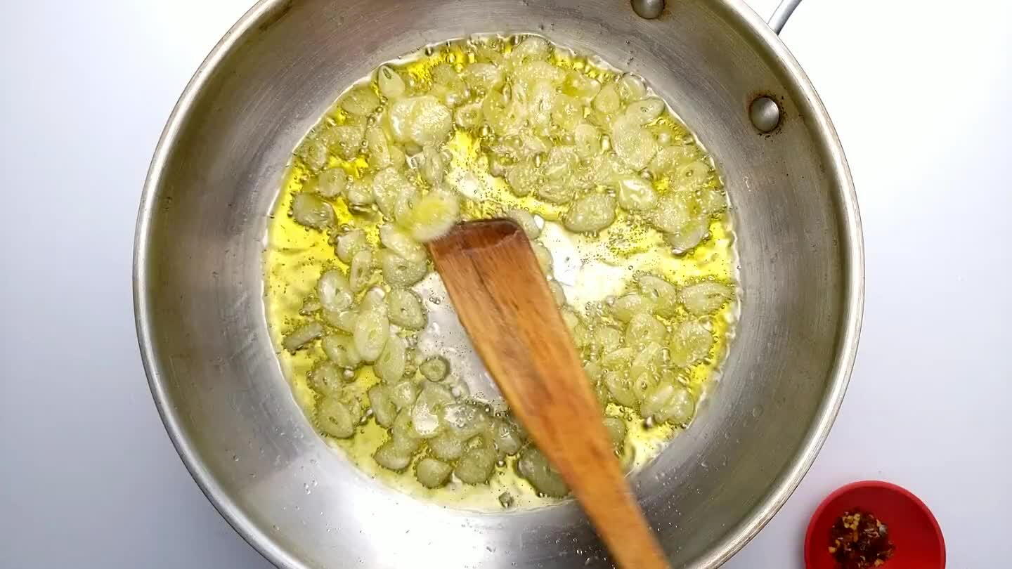 s of the garlic curl up slightly and the aroma hits you in the face. Remove from heat.