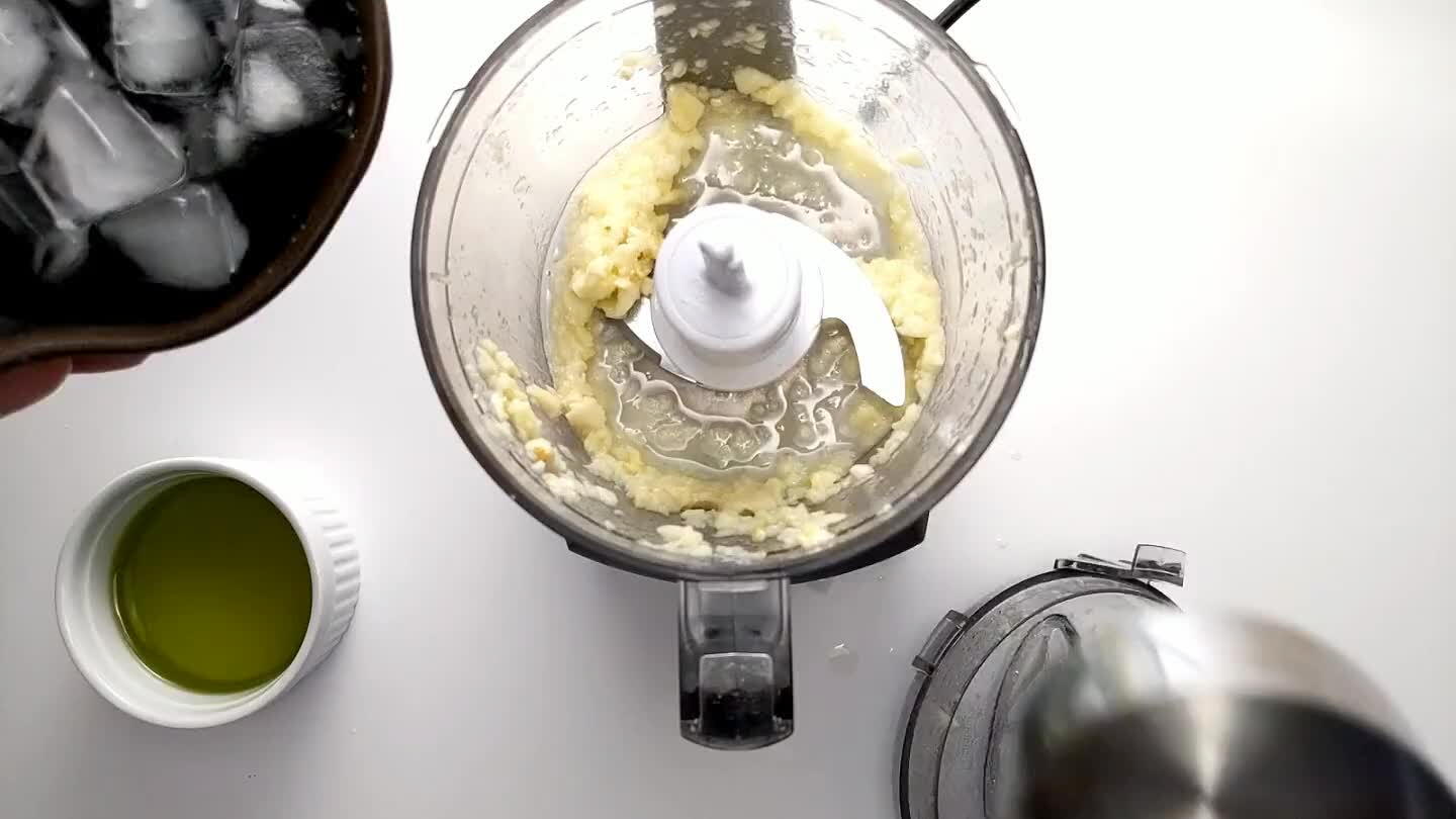 own the edges of the blender, until the garlic is finely chopped.