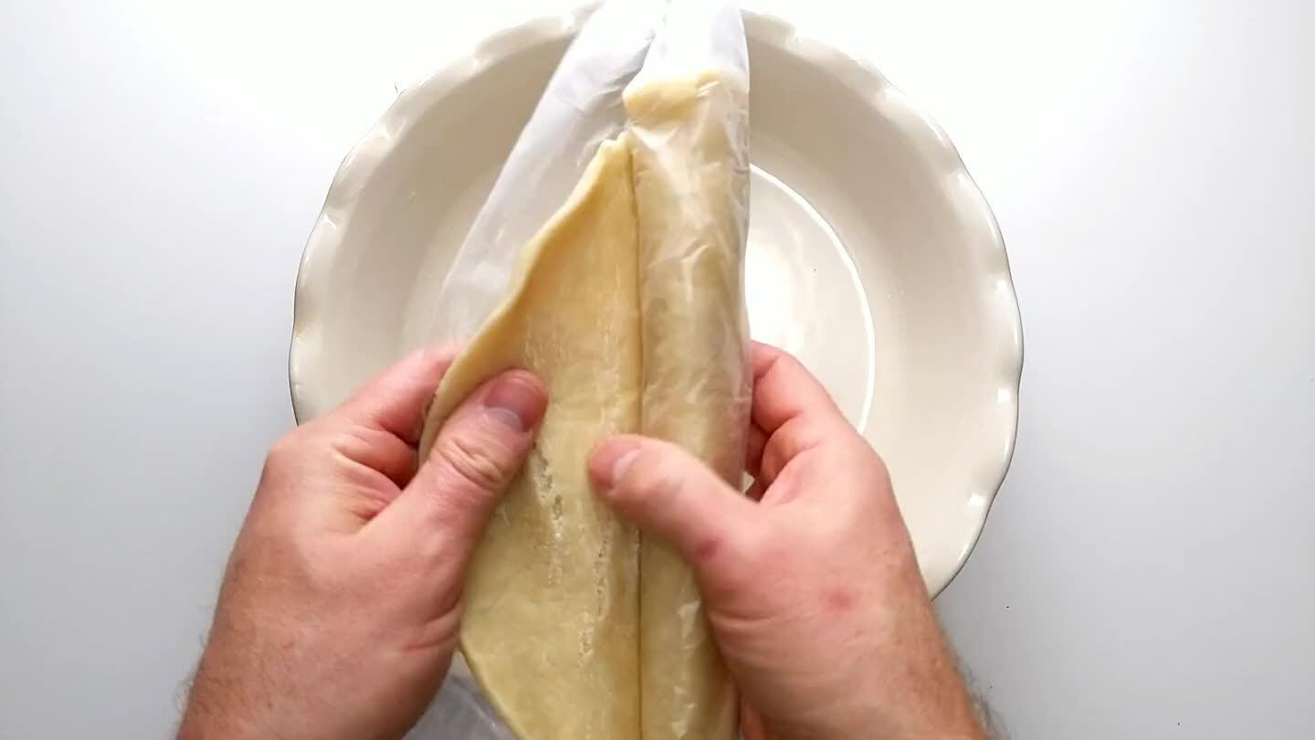 ressing out any air bubbles, and shape the dough up the edges of the dish.