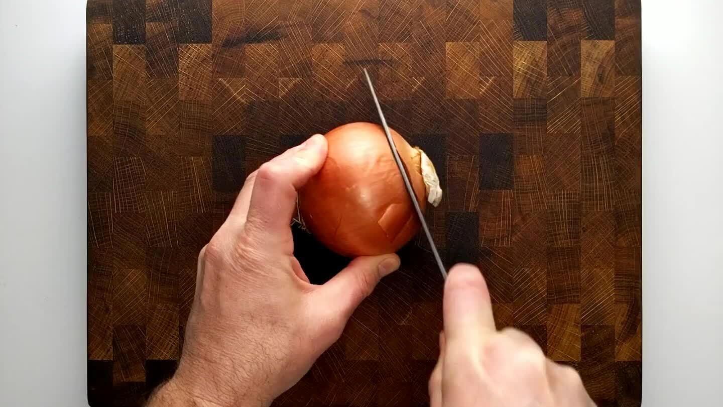 is and remove the peel. Slice parallel to the center axis, angling the blade with the curve of the onion to try and get similarly shaped slices.