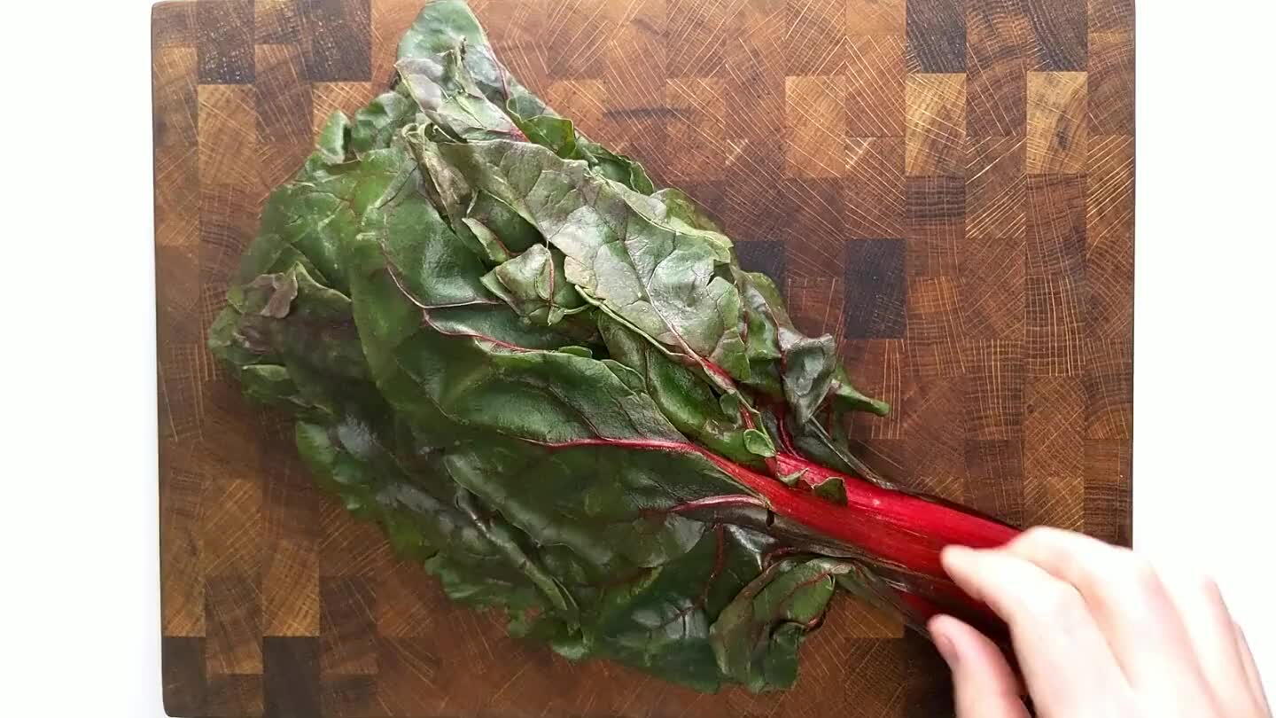 joins to the stem and dragging your fingers along the stem to gently tear away the leaf. Bundle up the leaves and slice to about 1/2".