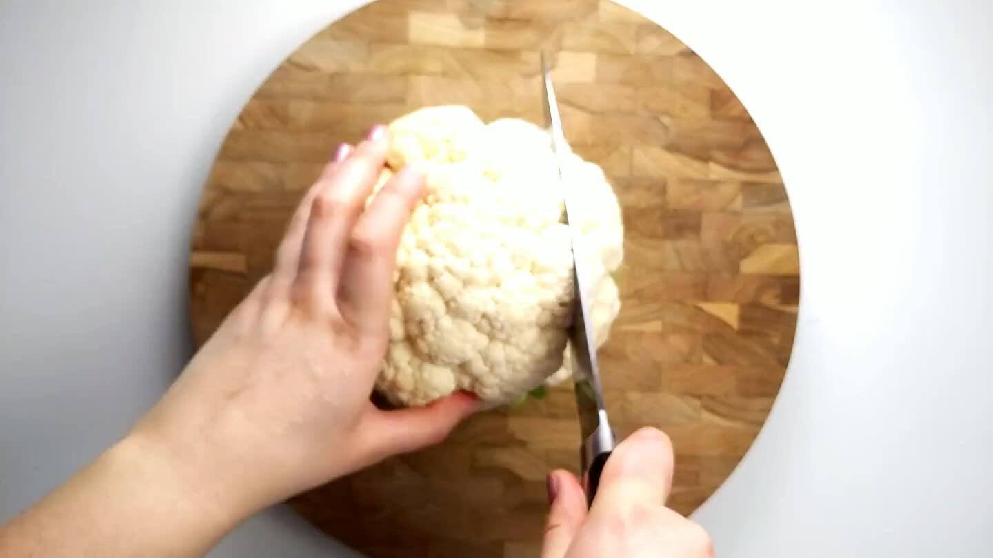 f the cauliflower leaving just the middle. Don't worry about removing the leaves just yet. Cut the middle portion in half leaving two 1 inch cauliflower steaks. Then cut just the leaves from each steak. Reserve the leftover cauliflower to roast alongside the steaks.