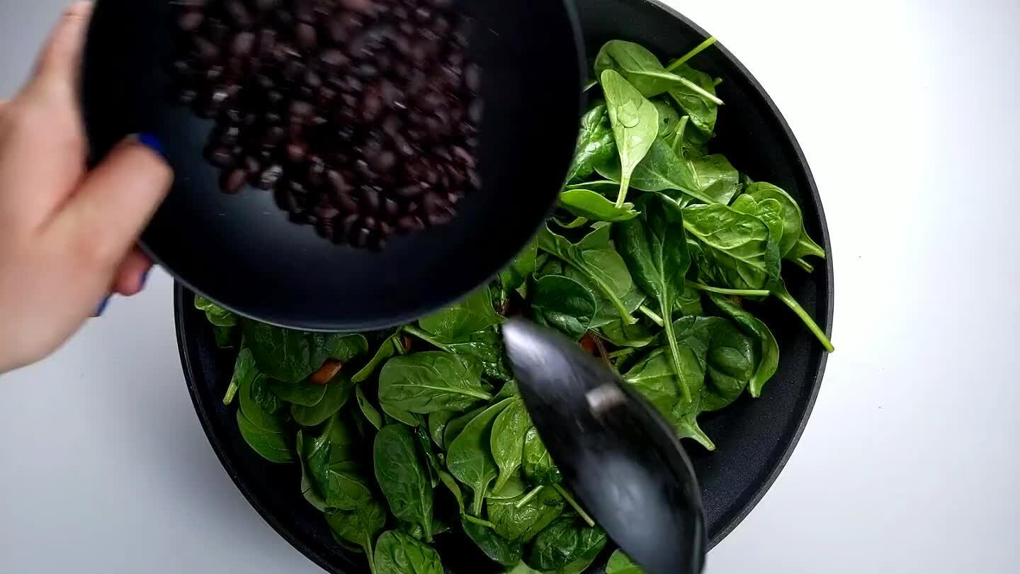 until the spinach is wilted and the black beans are heated through.