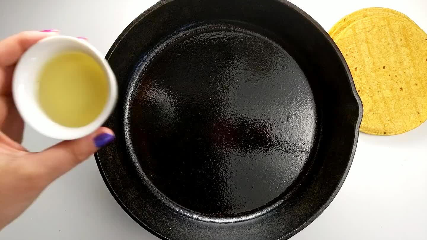 ortillas into bite-sized pieces and drop into the hot oil.