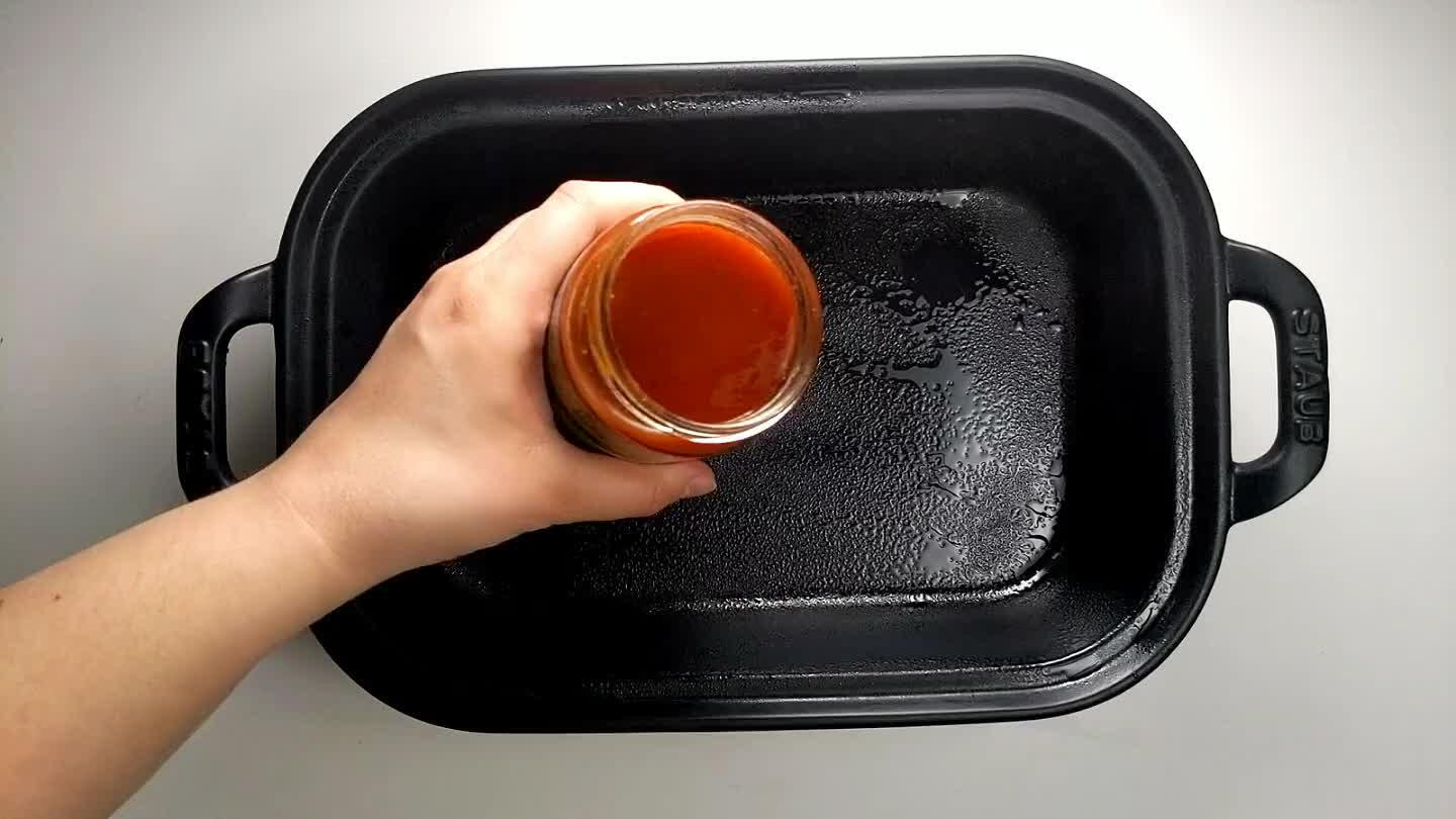 e tater tot and beef mixture into the baking pan, and top with the rest of the enchilada sauce.