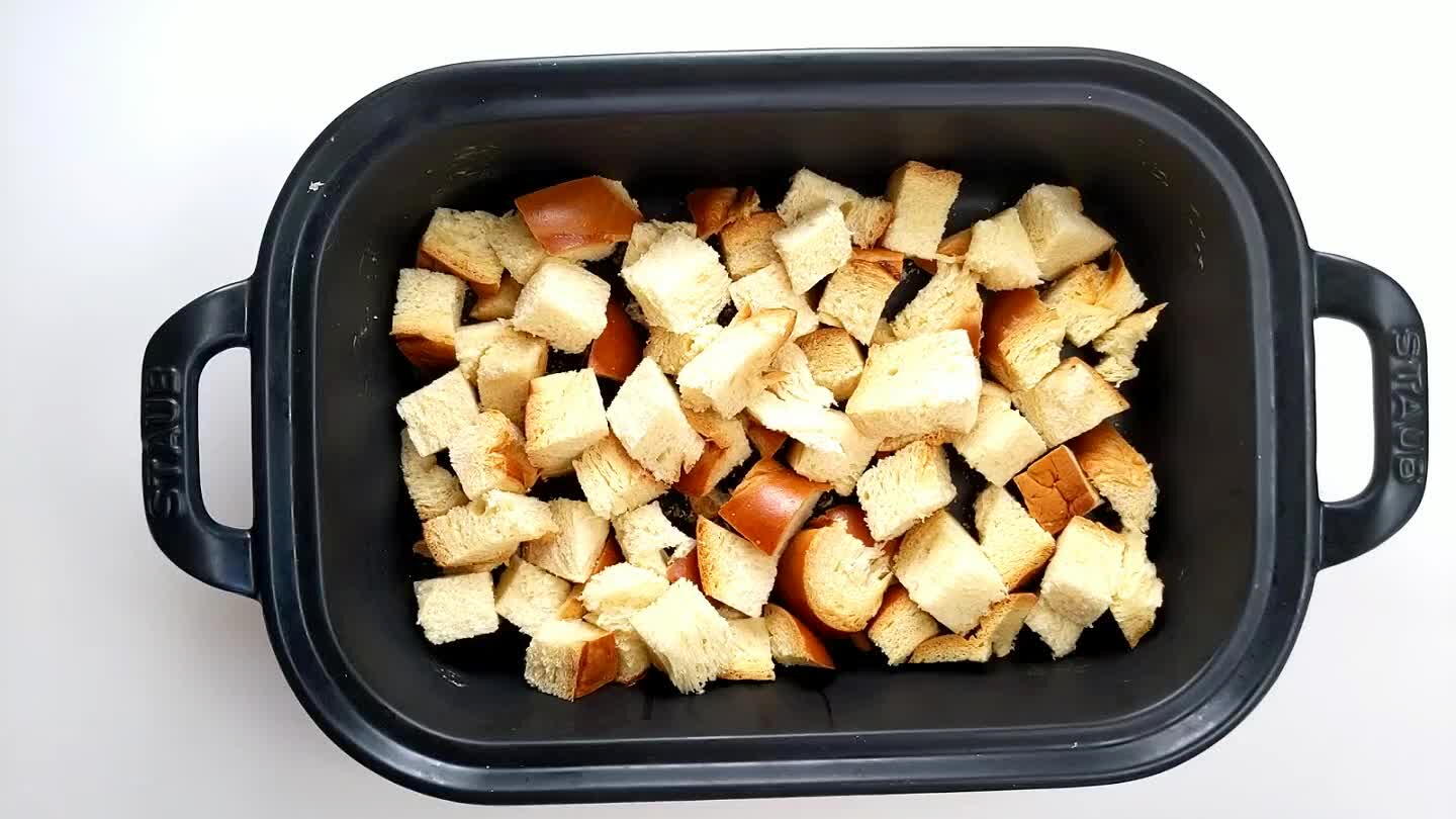 Layer the toppings adding half the cheese and half the sausage onion mix, then another layer of bread.