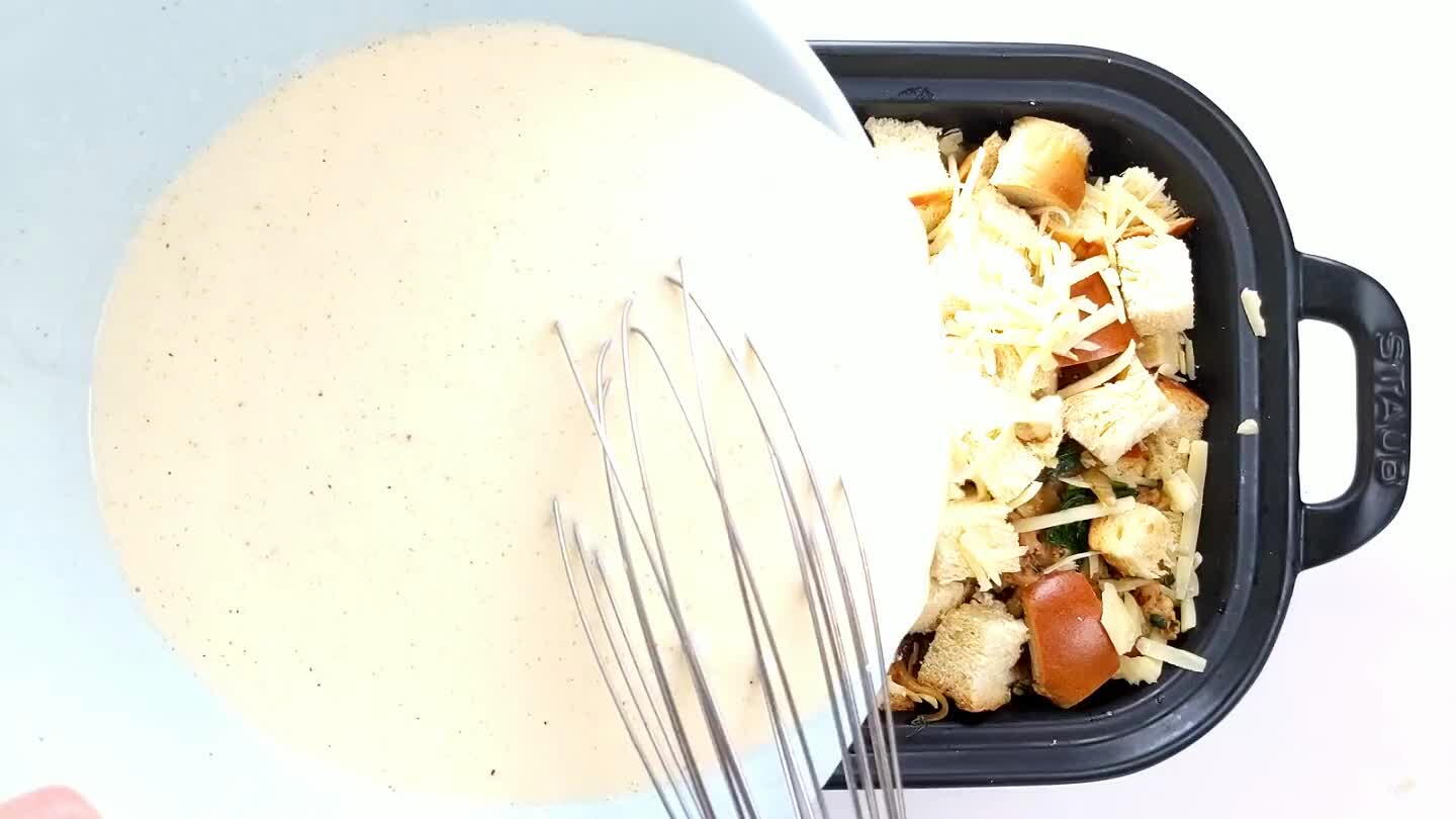 he rest of the cheese. Use the whisk or spoon to push the bread down and get it all soaked.