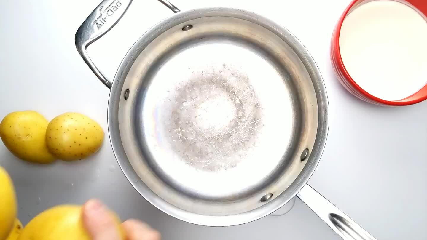 the cream over the top. You should have enough cream to submerge the potatoes. If not, cut them into halves or quarters so they'll stay beneath the surface of the cream.