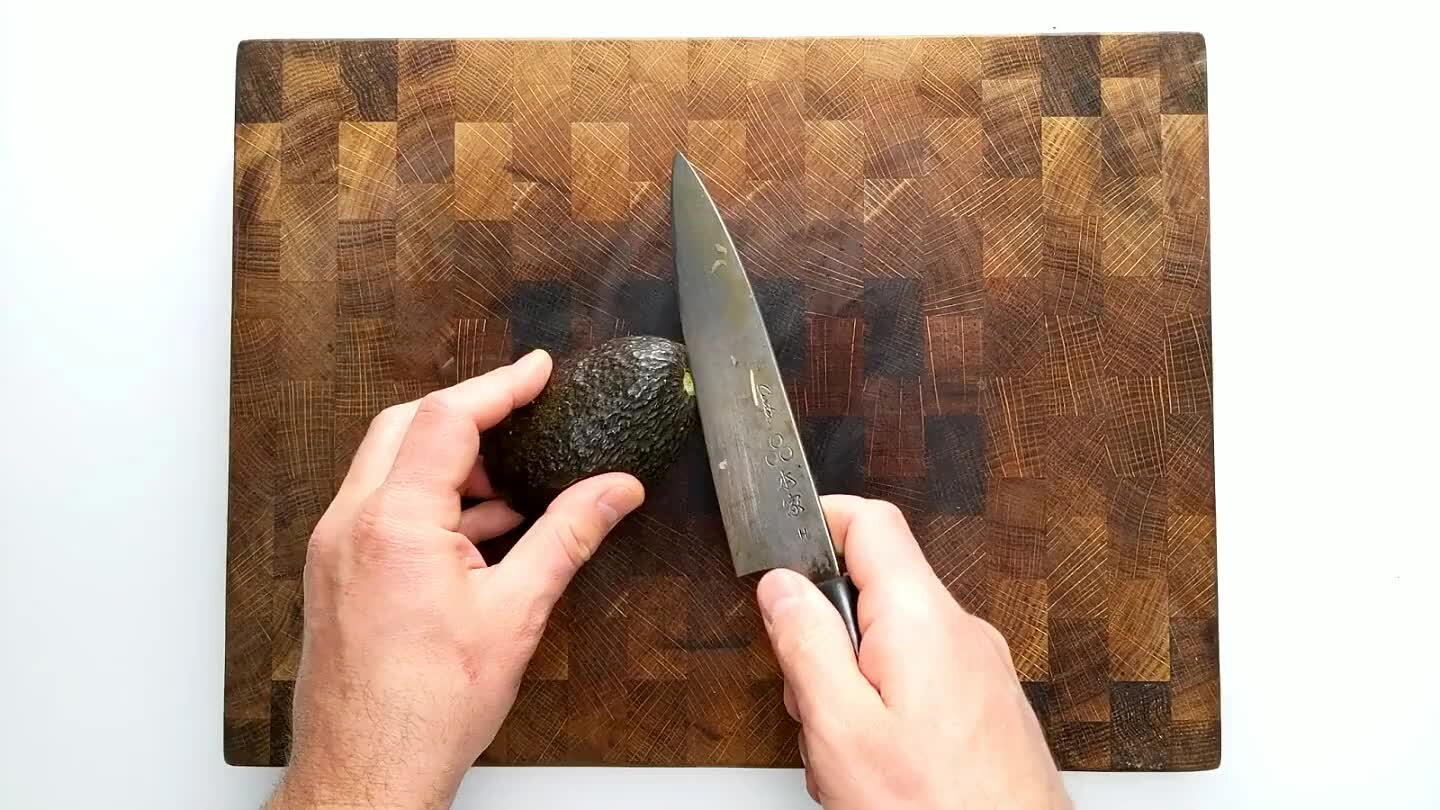 eed below. Roll the seed along the knife to cut an even ring around the pit. Twist the avocado halves against each other to separate. Flick the blade of the knife into the avocado seed and twist to release the seed. Scoop out the flesh and dice.