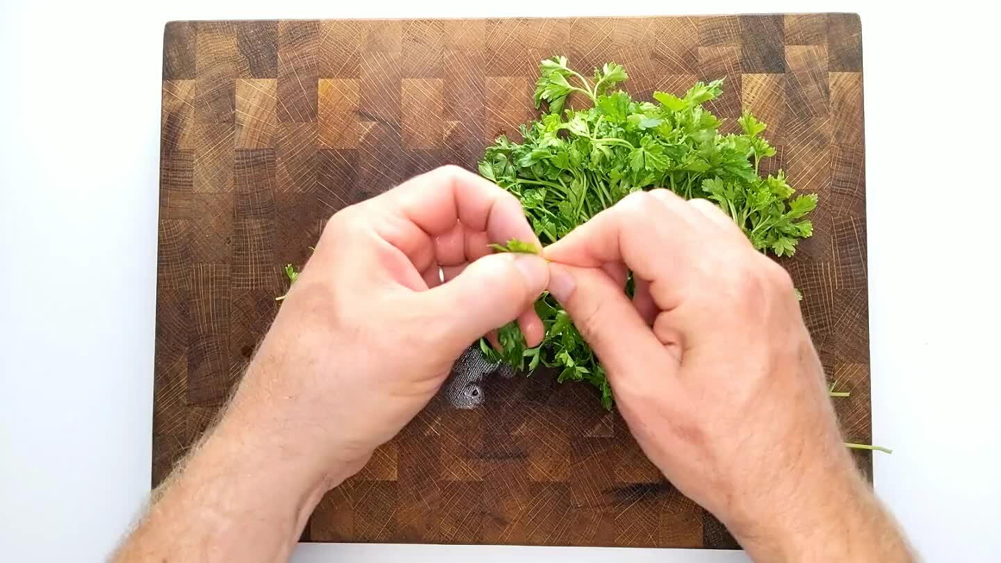 e here is quite flexible. Parsley bunches can vary in size. Chop enough to thicken out the sauce. Roll the leaves up in a bundle and slice thin. Then, with your dominant hand on the knife handle and pinning the point of the blade with the opposite hand, rock your knife like a seesaw back and forth over the pile.