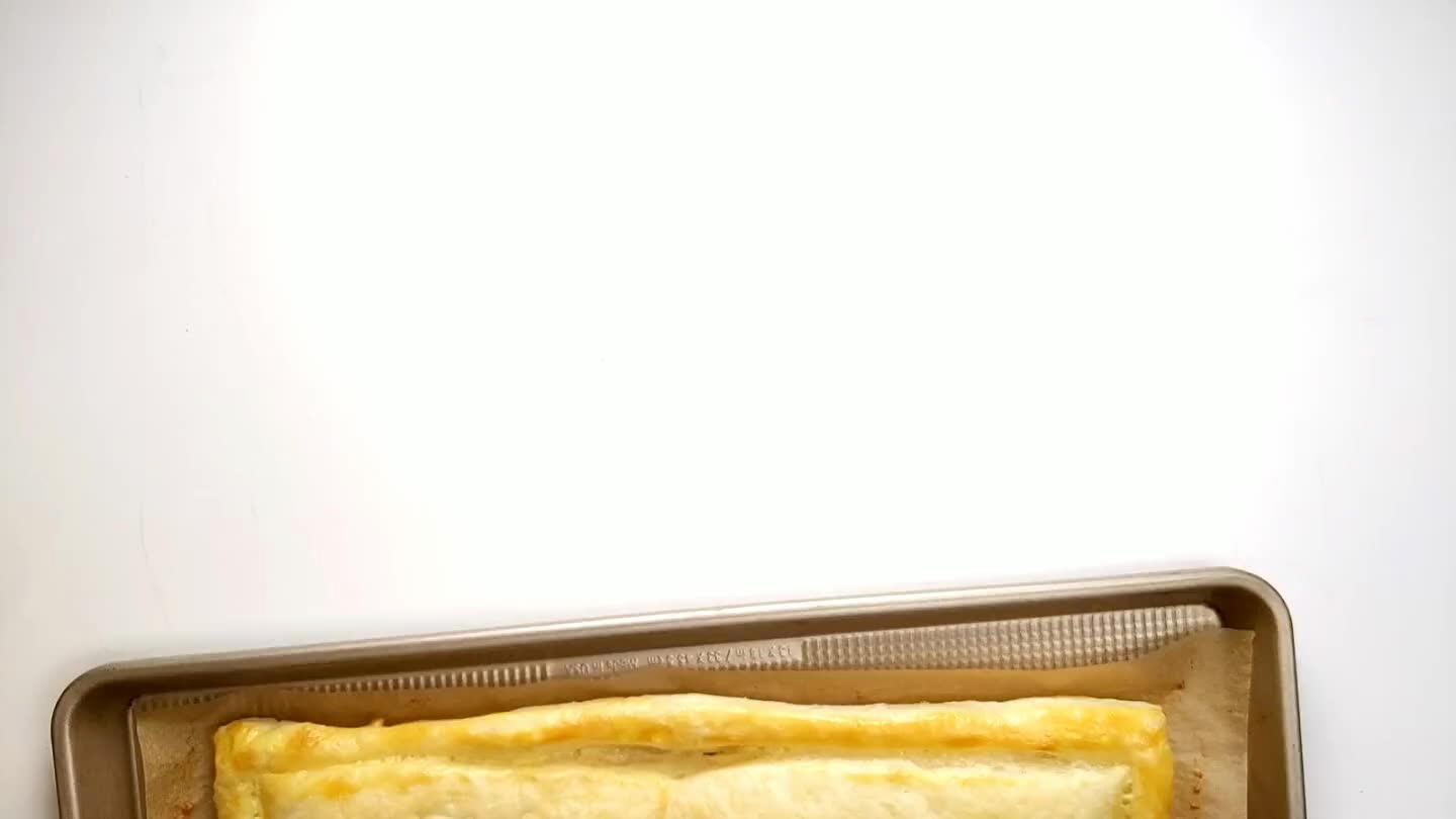 in an even layer on the pastry, staying within the border.