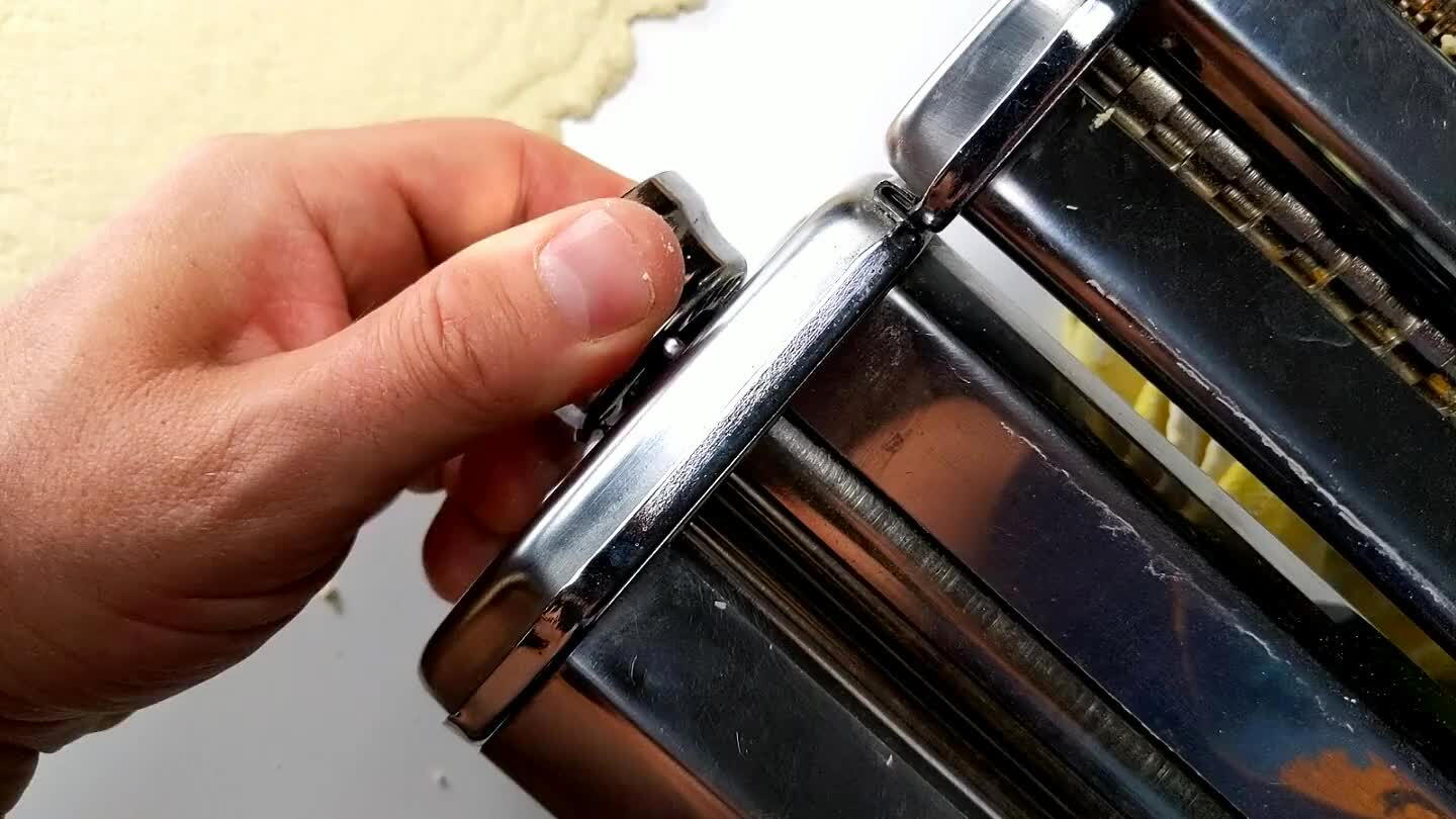 a notch. Pass the dough through. Tighten again and pass the dough again. If the dough gets wrinkled or torn, you can just back up a level or two and restart. Once you get down to the finer settings, start thinking about how thick you want your noodles.