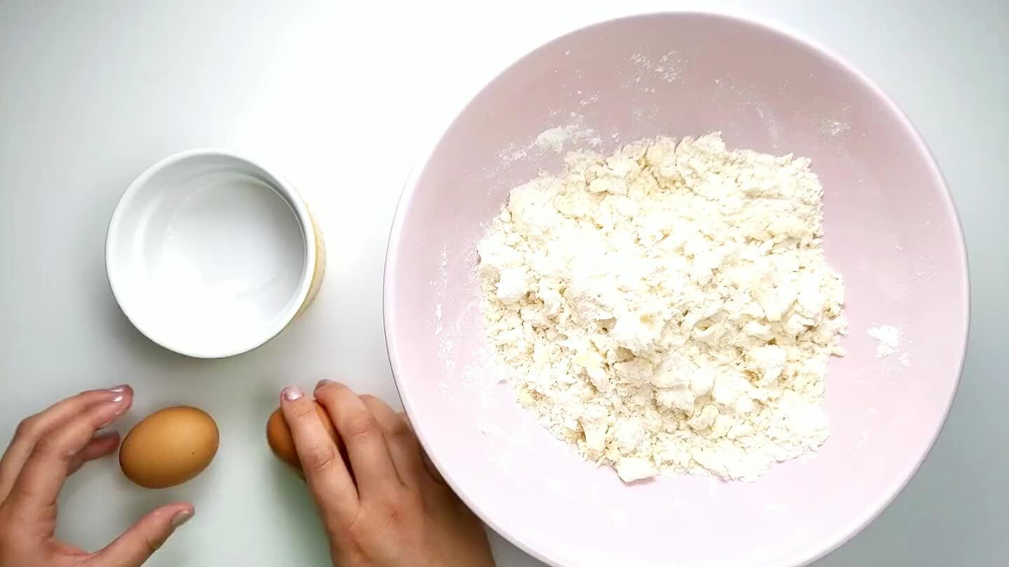 he yolks into the dough until the dough can be pressed together and keep shape.