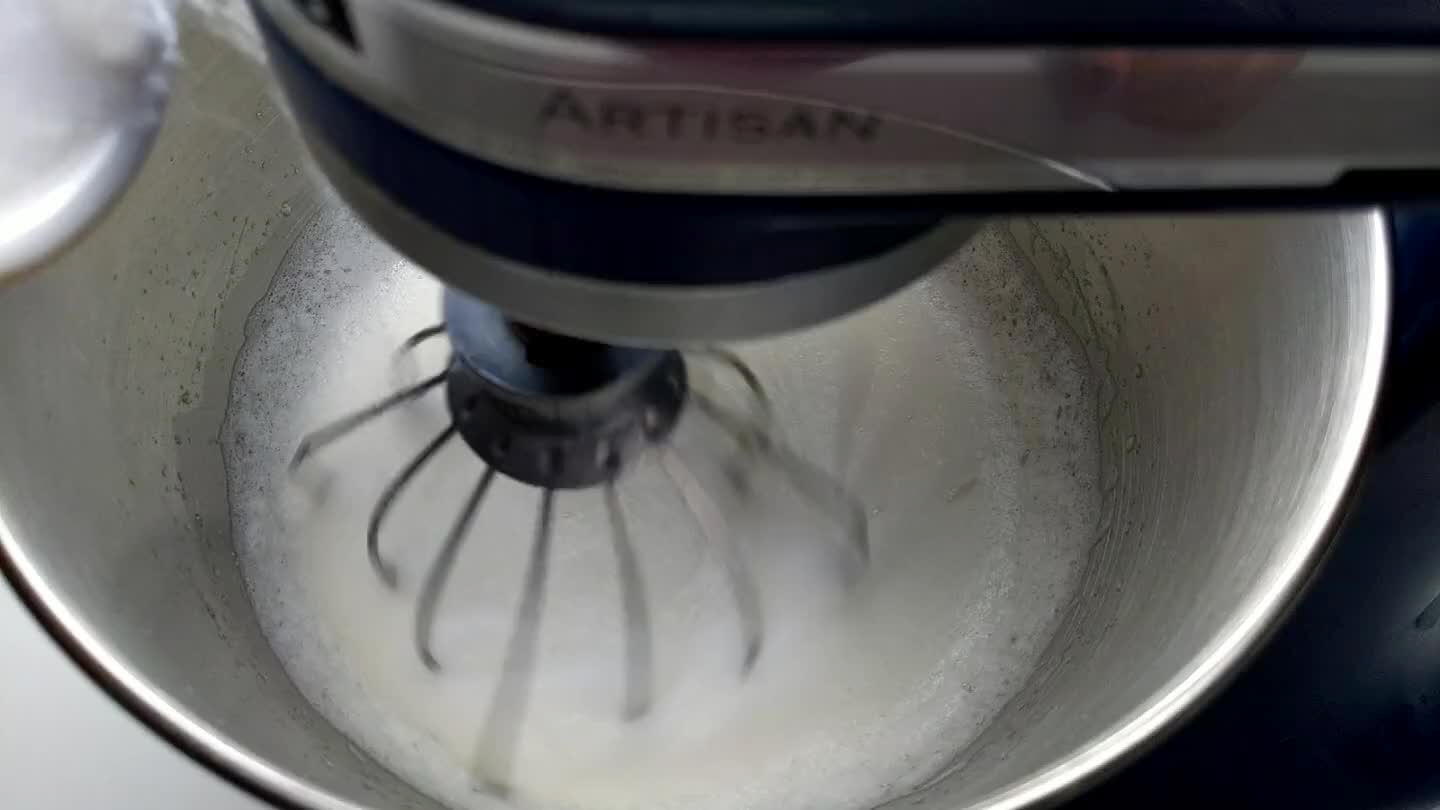 too much sugar goes in at once, the sugar won't dissolve. Whip until the egg whites are at stiff peak stage.