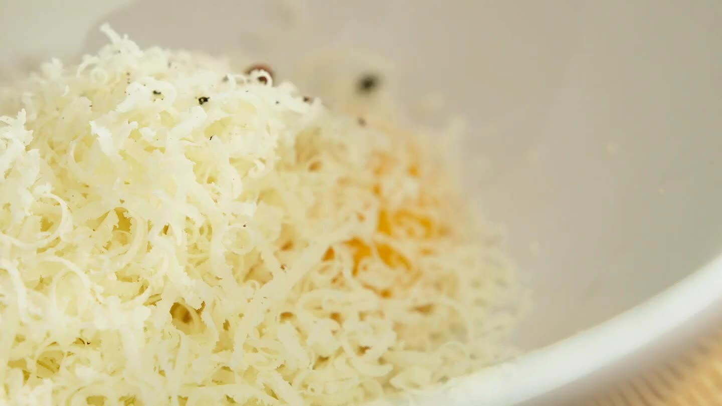 a generous pinch of black pepper. Add a splash of the pasta water to the mixture and whisk until smooth.