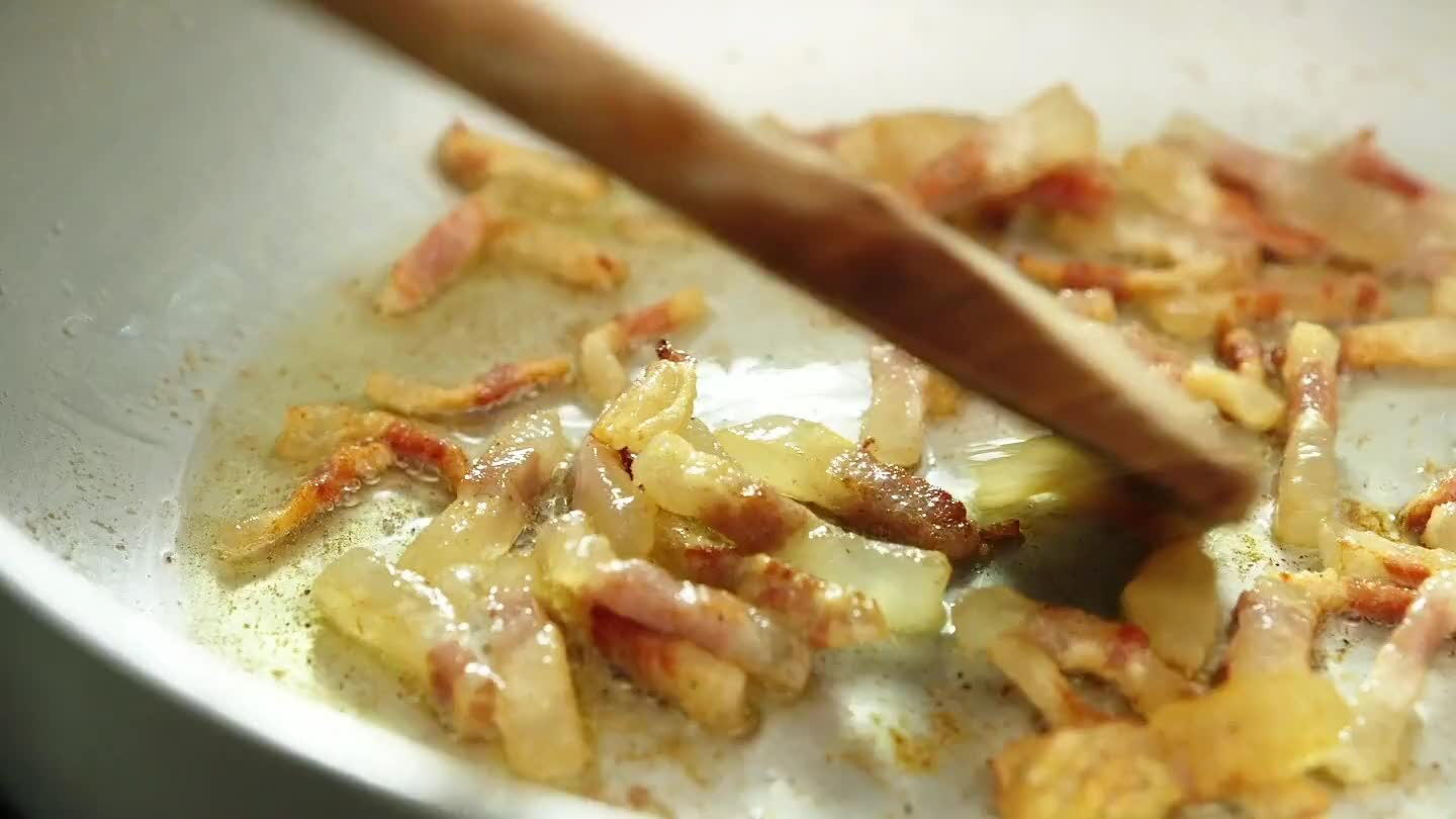 the pan with the guanciale. Pour the egg and cheese mixture into the pan with the pasta and guanciale. Mix well, and add some of the pasta water if necessary.
