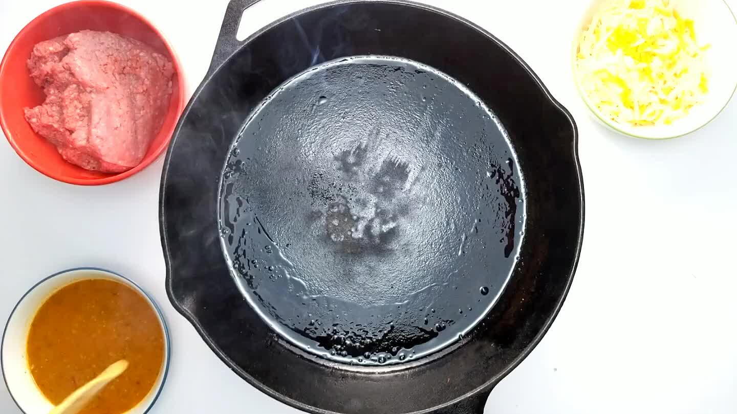 ak it apart with a wooden spoon and cook until it begins to brown.