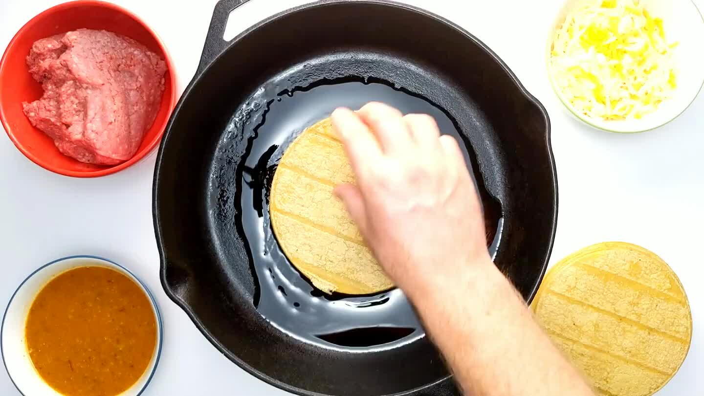 ugh that they bubble slightly and soak up some hot oil, making them easier to roll up. Transfer the tortillas to a side dish.