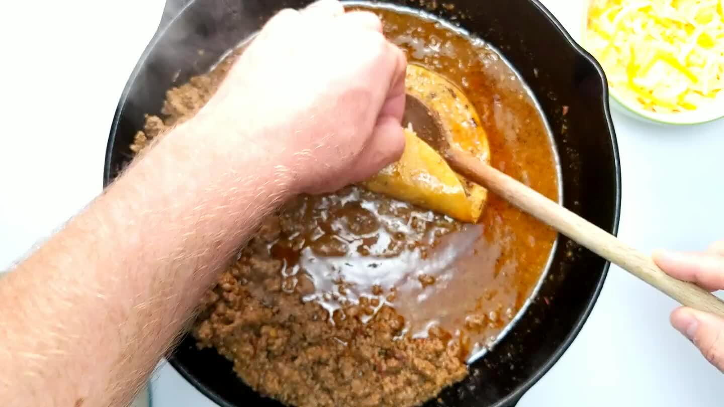 a up against the edge of the pan.