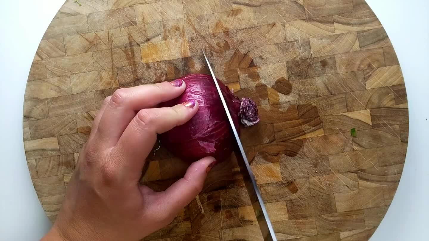 ide of the onion two times with the knife parallel to the cutting board leaving the root end in-tact.