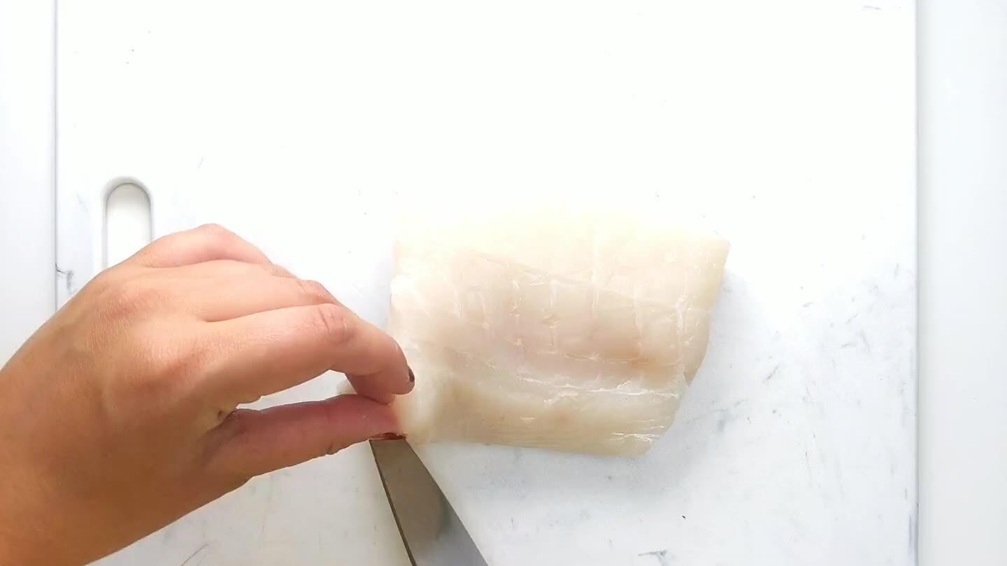 the skin with the blade pointing down and away from you. Gently move the knife in a sawing motion while you hold tightly and pull the skin in the opposite direction. Cut the fish into 1/4 lb portions.