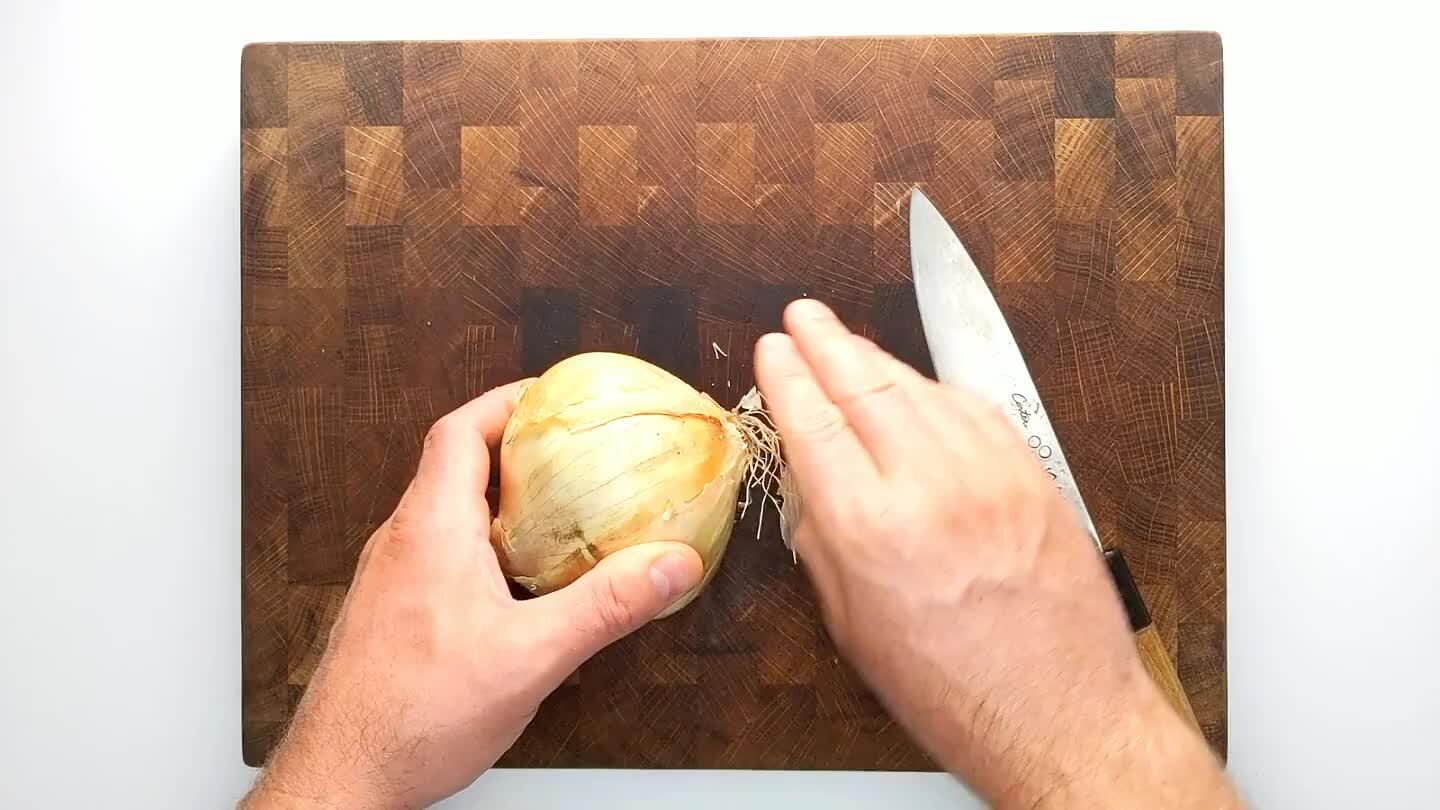 from the top, perpendicular to the sliced stem face without cutting through the root end. Slice again from the top perpendicular to the previous slice to dice.