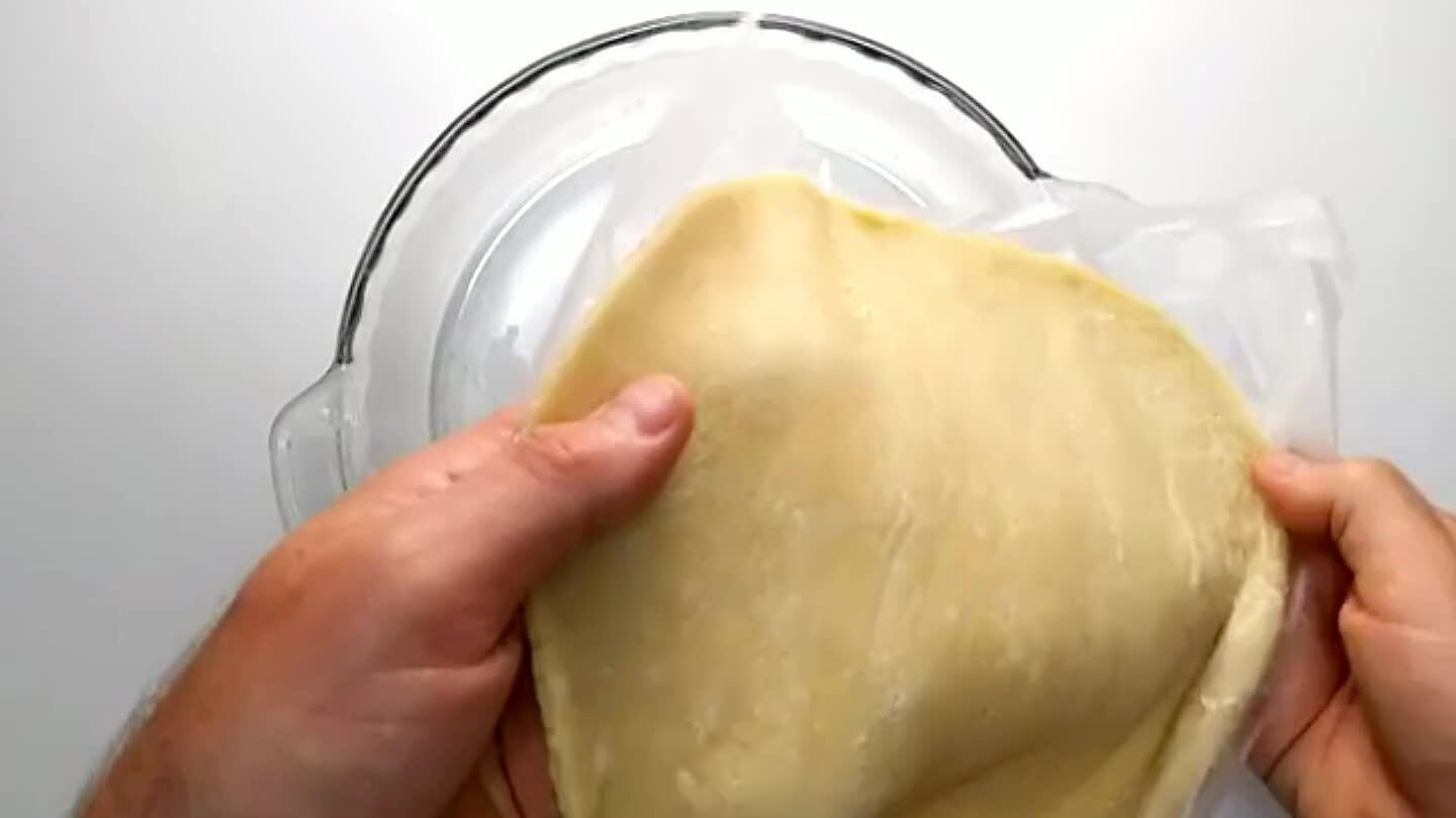 ut any air bubbles.Form the and working the dough up the sides of the dish.