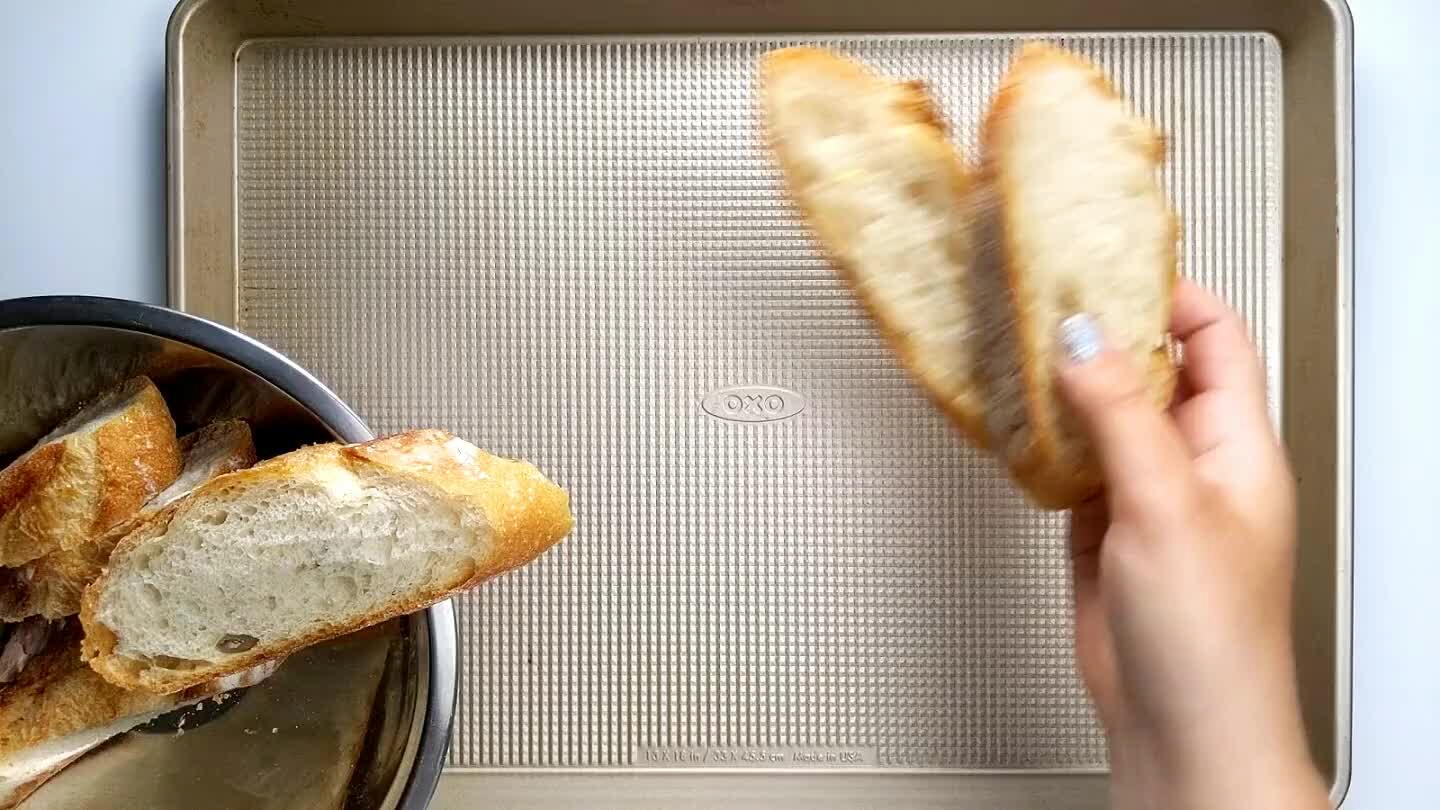 under the broiler for about 5 minutes. Every oven is different though so keep a close eye on the bread as to not burn it.