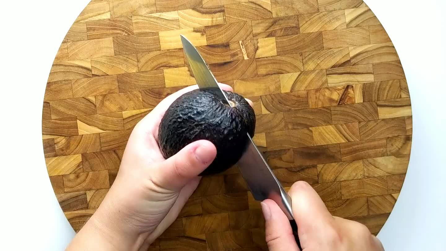 he pit out. Carefully cube the avocado in the peel.